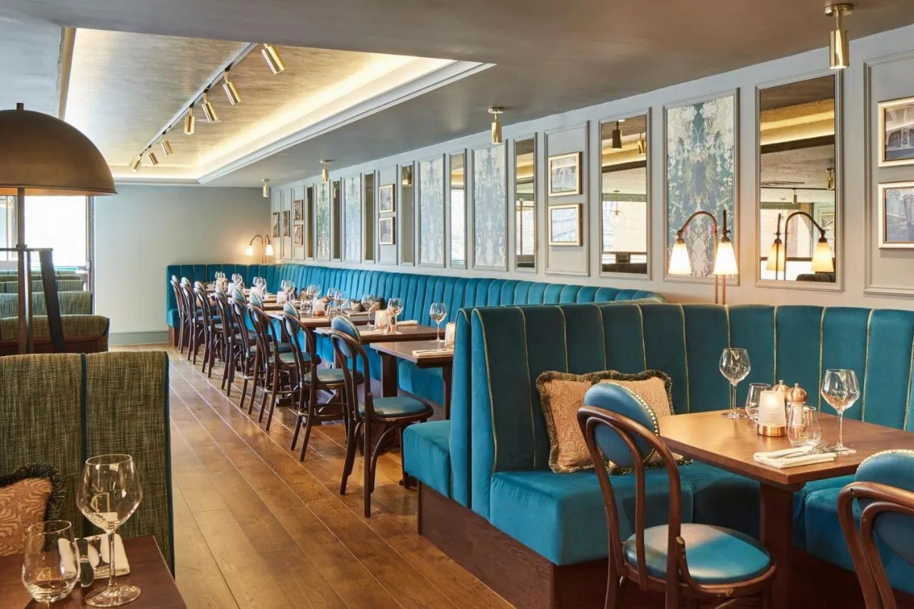 A row of tables and chairs in a restaurant at Cardiff Marriott Hotel in Cardiff